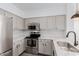 Kitchen featuring stainless steel appliances, modern countertops, and bright overhead lighting at 20100 N 78Th Pl # 2114, Scottsdale, AZ 85255