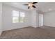 Bright living room featuring neutral carpet, recessed lighting, and window views at 20100 N 78Th Pl # 2114, Scottsdale, AZ 85255