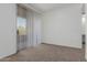Sunlit living room with access to outdoor space and neutral carpet at 20100 N 78Th Pl # 2114, Scottsdale, AZ 85255