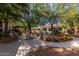 Inviting pool area featuring a grill, dining table, and lush landscaping for outdoor relaxation at 20100 N 78Th Pl # 2114, Scottsdale, AZ 85255