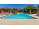 Beautiful pool surrounded by mature landscaping, lounge chairs and shade, creating a relaxing environment at 20100 N 78Th Pl # 2114, Scottsdale, AZ 85255