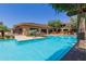 Relax by the inviting pool area with surrounding lush landscaping, plenty of lounge seating, and shade for all at 20100 N 78Th Pl # 2114, Scottsdale, AZ 85255