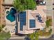 Stunning aerial view featuring a private backyard oasis, solar panels, and a sparkling pool at 2024 N 125Th Ave, Avondale, AZ 85392