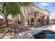 Backyard showcasing the pool, covered patio, balcony, and house exterior at 2024 N 125Th Ave, Avondale, AZ 85392