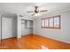 Bedroom featuring hardwood floors, neutral paint and a ceiling fan at 2024 N 125Th Ave, Avondale, AZ 85392