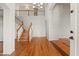 Grand foyer with hardwood floors, staircase, and high ceilings at 2024 N 125Th Ave, Avondale, AZ 85392