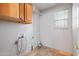 Laundry room with cabinets, a small window, tiled floors, and laundry hook ups at 2024 N 125Th Ave, Avondale, AZ 85392