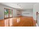 Bright living room featuring hardwood floors, French doors, and natural light at 2024 N 125Th Ave, Avondale, AZ 85392