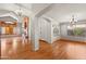 Open-concept living room with hardwood floors and a fireplace at 2024 N 125Th Ave, Avondale, AZ 85392