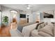 Spacious main bedroom featuring hardwood floors, ensuite bathroom and walk-in closet at 2024 N 125Th Ave, Avondale, AZ 85392