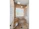 Shower with a window made of glass blocks and a built-in bench at 2024 N 125Th Ave, Avondale, AZ 85392