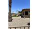 An appealing backyard showcases desert landscaping and a built-in outdoor kitchen at 20332 N Denizen Dr, Surprise, AZ 85387