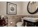Powder room with pedestal sink, dark trim, mosaic tile and unique decor at 20332 N Denizen Dr, Surprise, AZ 85387