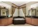 Bright bathroom featuring granite countertops, bathtub, and an abundance of natural light at 20332 N Denizen Dr, Surprise, AZ 85387