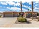 Charming single-story home featuring a three-car garage and meticulous desert landscaping at 20332 N Denizen Dr, Surprise, AZ 85387