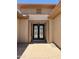 Close up of the front entrance with decorative glass doors and neutral stucco exterior at 20332 N Denizen Dr, Surprise, AZ 85387