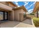 Welcoming front entrance showcasing custom door detail and desert landscaping at 20332 N Denizen Dr, Surprise, AZ 85387