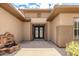 Elegant entryway features a beautiful fountain and custom wrought iron double doors at 20332 N Denizen Dr, Surprise, AZ 85387