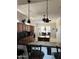 Spacious kitchen featuring dark wood cabinetry, black countertops, and a central island at 20332 N Denizen Dr, Surprise, AZ 85387