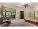 Primary bedroom with large glass sliding doors opening to the patio and pool area at 20332 N Denizen Dr, Surprise, AZ 85387