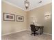 Cozy home office with a stylish desk, chair, and decorative wall sconces at 20332 N Denizen Dr, Surprise, AZ 85387