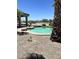 Backyard pool and spa area surrounded by decorative rock landscaping at 20332 N Denizen Dr, Surprise, AZ 85387