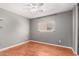 A calming bedroom boasts a neutral color scheme, great natural light, and wood laminate flooring at 2202 S Lawther Dr, Apache Junction, AZ 85120