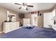 Bright bedroom featuring wood floors, a ceiling fan and neutral walls for a cozy feel at 2202 S Lawther Dr, Apache Junction, AZ 85120