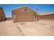 Beautiful home featuring a spacious driveway and a two-car garage, surrounded by well-maintained desert landscaping at 2202 S Lawther Dr, Apache Junction, AZ 85120