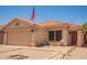 Welcoming single-story home with charming desert landscaping and a delightful front patio seating space at 2202 S Lawther Dr, Apache Junction, AZ 85120