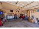 Spacious garage offering ample storage, tool chests, and organization racks, ideal for hobbyists and car enthusiasts at 2202 S Lawther Dr, Apache Junction, AZ 85120