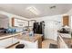Efficient kitchen featuring white cabinets, a kitchen island, tile flooring and essential appliances at 2202 S Lawther Dr, Apache Junction, AZ 85120