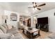 Inviting living room featuring tile flooring, a ceiling fan, and ample space for furniture arrangement at 2202 S Lawther Dr, Apache Junction, AZ 85120