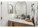 The bathroom has modern wood cabinets and marble countertops at 22414 W Meade Ln, Buckeye, AZ 85326