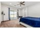 Bright bedroom features a sliding glass door leading to a patio, enhancing natural light at 22414 W Meade Ln, Buckeye, AZ 85326
