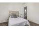 Bedroom features neutral tones and a door leading to the ensuite bath at 22414 W Meade Ln, Buckeye, AZ 85326