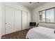 Bedroom features closet, window, and tv at 22414 W Meade Ln, Buckeye, AZ 85326