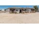 Single-story home features stone accents, complemented by wood fencing, enhancing its curb appeal at 22414 W Meade Ln, Buckeye, AZ 85326