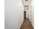 Hallway with wood floors and neutral paint at 22414 W Meade Ln, Buckeye, AZ 85326