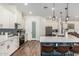 Modern kitchen featuring stainless steel appliances, white cabinetry, and a stylish blue island at 22414 W Meade Ln, Buckeye, AZ 85326