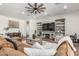 Spacious living room with a ceiling fan, built-in shelving, and comfortable seating at 22414 W Meade Ln, Buckeye, AZ 85326