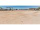 Large, dirt lot with block wall and metal awning offers endless possibilities to create your dream space at 22414 W Meade Ln, Buckeye, AZ 85326