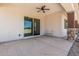 Relaxing covered patio with stone pillars and ceiling fan at 22414 W Meade Ln, Buckeye, AZ 85326