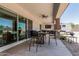 Cozy covered patio with ceiling fan and outdoor seating area at 22414 W Meade Ln, Buckeye, AZ 85326