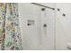 The shower features sleek white subway tile and a storage niche at 22414 W Meade Ln, Buckeye, AZ 85326