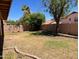 Large backyard featuring mature trees and a block wall for privacy at 2723 E Rockledge Rd, Phoenix, AZ 85048