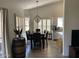Dining area with chandelier, views and lots of light from shuttered windows at 2723 E Rockledge Rd, Phoenix, AZ 85048