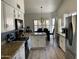 Bright kitchen with white cabinets, granite countertops, and stainless steel appliances at 2723 E Rockledge Rd, Phoenix, AZ 85048