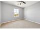 Bedroom with neutral carpet, ceiling fan, and a window for natural light at 3025 E Fremont Rd, Phoenix, AZ 85042