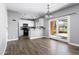 Open kitchen area features white cabinetry, modern appliances, and sliding door at 3025 E Fremont Rd, Phoenix, AZ 85042